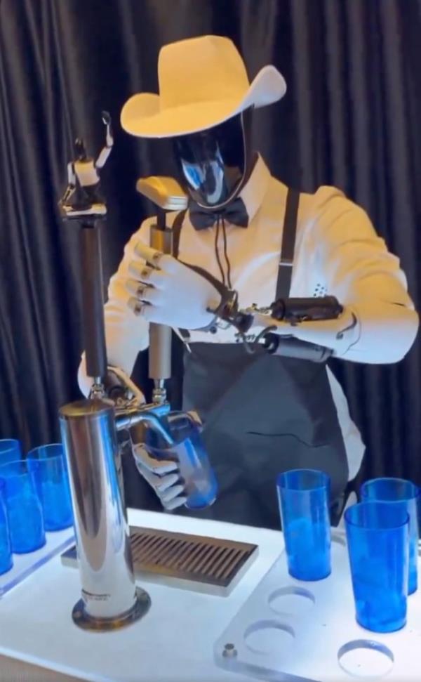 An Optimus robot serving drinks during Tesla event on Oct. 10, 2024.